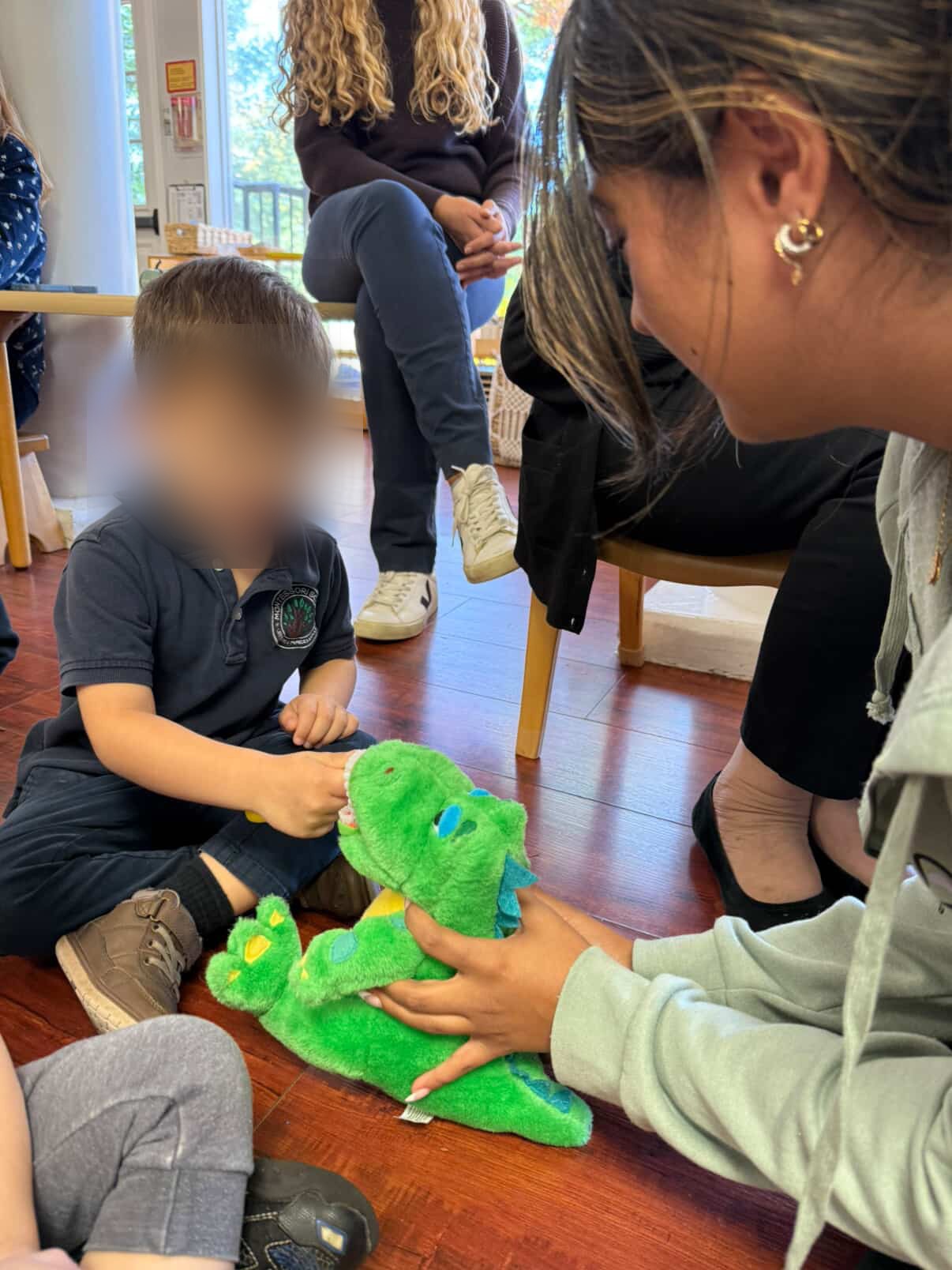 Testing the book with children — 2 (face blurred for privacy)